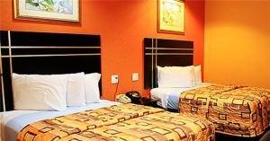 Postel nebo postele na pokoji v ubytování Executive inn Bacliff