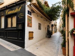 a street in a city with a building at Beautifully Bright Apartment in Old Town Saint-Tropez in Saint-Tropez