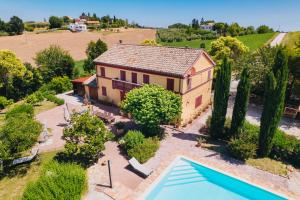 an aerial view of a house with a swimming pool at Italian Experience-Casa Bellavista in Ostra