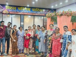 a group of people posing for a picture at an event at Hotel Parinay Vatika in Deoghar