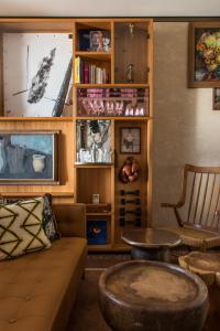 a living room with a couch and a table at Brach Madrid - Evok Collection in Madrid