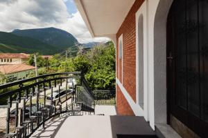 a balcony of a building with a view of a street at Dea Apartments - Peja in Peje