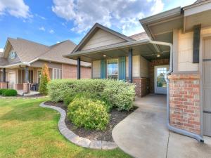 a house with a walkway leading to the front door at Exquisite Escape in Moore! in Moore