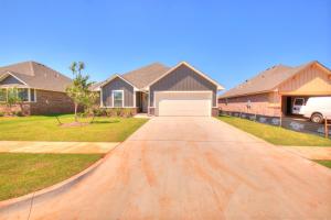 a driveway in front of a house at Oklahoma City's Hidden Gem in Moore