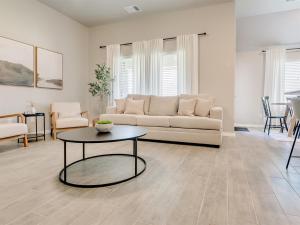 a living room with a couch and a table at Oklahoma City's Hidden Gem in Moore