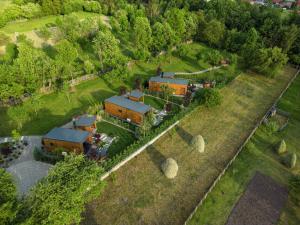 an aerial view of a house with a train at Nordlys Retreat in Teşila +22 photos