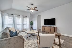 a living room with a couch and a flat screen tv at Hazy Hollow Escape 4816 in Crowley +25 photos