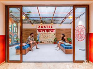 a group of people sitting in a waiting room at Zostel Kolkata in Kolkata