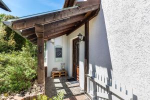 a wooden pergola over the door of a house at Cottage in Schlangenbad in Schlangenbad