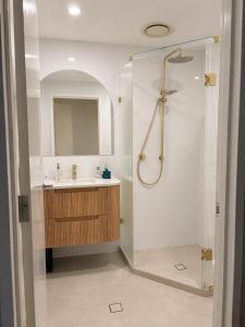 a bathroom with a shower and a sink at Sundown terrace in North Fremantle