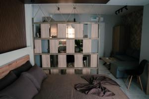 a living room with a couch and a chair at Village Bliss in Kardamaina