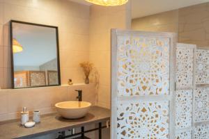a bathroom with a sink and a mirror at LE JOLI BOIS in Colroy-la-Roche +37 photos
