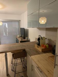 a kitchen with a wooden counter top in a room at Apartment with pool and beach access 2 No 31 in Quiberon