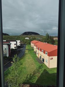 a view of a group of buildings from a window at Hótel Bifröst in Bifrost