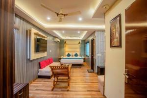 a room with a bed and a table and a chair at Hotel Galaxy international Delhi igi Airport Free pickup in Ghaziabad