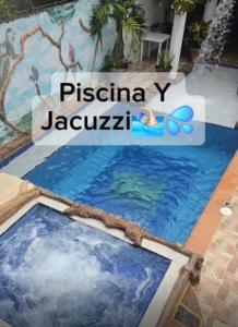 a swimming pool with a girl on a raft in the water at Casa de Descanso la Cascada in Sopetrán