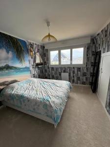 a bedroom with a bed in a room with windows at Maison proche centre ville in Quiberon