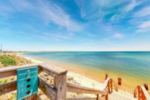 a view of the beach from a boardwalk at Moon Tide - Bayside Beach Access & Parking in Provincetown