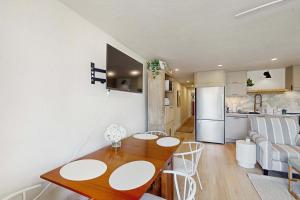 a kitchen and a living room with a dining room table at Moon Tide - Bayside Beach Access & Parking in Provincetown +16 photos