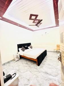 a bedroom with a bed with a number on the ceiling at m m residency in New Delhi