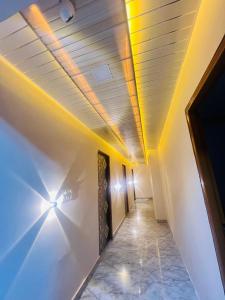 a hallway with a ceiling with lights on it at m m residency in New Delhi