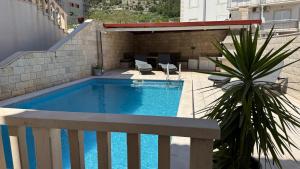 a swimming pool on top of a building at Villa Berlin in Bol