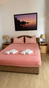 a bedroom with a large bed with two towels on it at Villa Berlin in Bol +60 photos