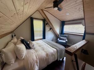 a bedroom with a large bed in a room at By the Docks Knox in Knoxville +9 photos