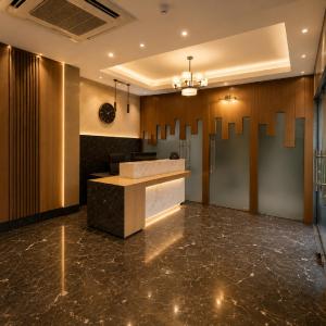 a lobby of a hotel with a reception desk at Hotel Paarth in Ludhiana