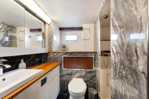 a bathroom with a toilet and a sink at Klassische Motoryacht Ocean Motion in Flensburg +25 photos