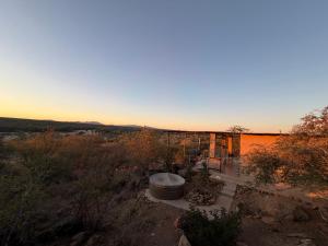 an overhead view of a building with a hot tub at Karibu Self-Catering unit 2 in Omaruru