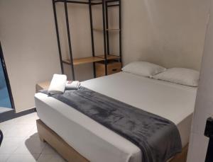a room with two beds in a room at Hotel Golden 70 in Medellín