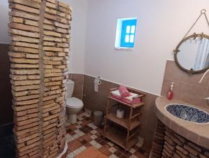 a bathroom with a toilet and a tub and a sink at daryemma2 in Asilah +41 photos
