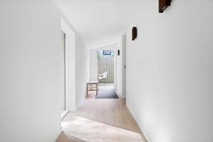 a hallway of a house with white walls at 1695-Hundested-Valdemar-Poulsensvej-11 in Lynæs