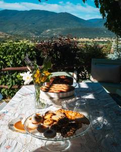 a table topped with plates of food on a table at B&B LE GRETTE in Gioia dei Marsi