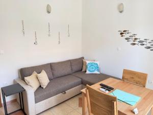 a living room with a couch and a table at TIMO Apartment Split Croatia in Kaštela +53 photos