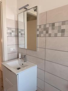 a bathroom with a sink and a mirror at Villa Cecilia in Portogruaro +22 photos