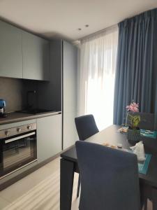 a kitchen and dining room with a table and chairs at AnnAmuri appartamento 23 in Belpasso