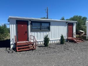 a small shed with red doors and two stairs at Athens House number 7A in Las Vegas