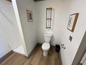 a white bathroom with a toilet in a room at Athens House number 7A in Las Vegas