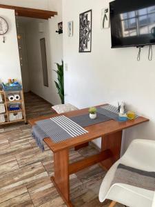 a wooden table in a living room with a tableablish at Arenales 2111 Recoleta in Buenos Aires