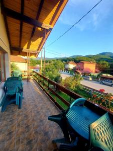 a porch with benches and a view of a street at Villa Ribarica in Ribarica