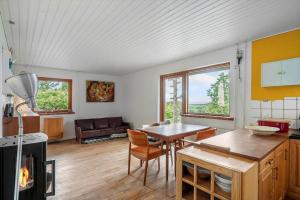 a kitchen and living room with a table and chairs at 4044-Borre-Klintholm-Havnevej-40 in Borre