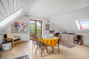 a kitchen with a table and chairs in a room at 4044-Borre-Klintholm-Havnevej-40 in Borre