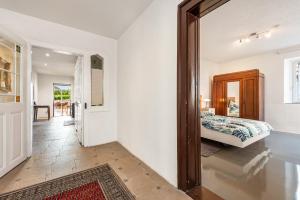 a bedroom with a bed and a mirror in a room at Apartment In A Historic Villa in Stockach
