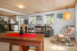 a living room with a couch and a table at 6010-Askeby-Fanefjordgade-71 in Askeby