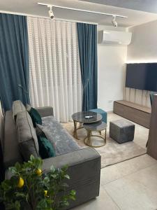 a living room with a couch and a table at Centar Spa Teslic in Teslić