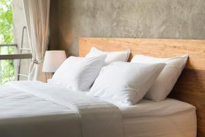 เตียงในห้องที่ Das Rapp - Hotel