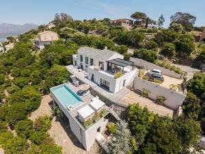 an aerial view of a house with a swimming pool at Villa ROYA in Saint-Florent