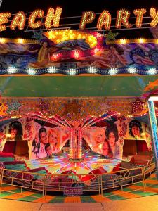 a carnival carousel with a sign that reads real fun at La Boîte Rose - Studio plage de l'Almanarre in Hyères +43 photos